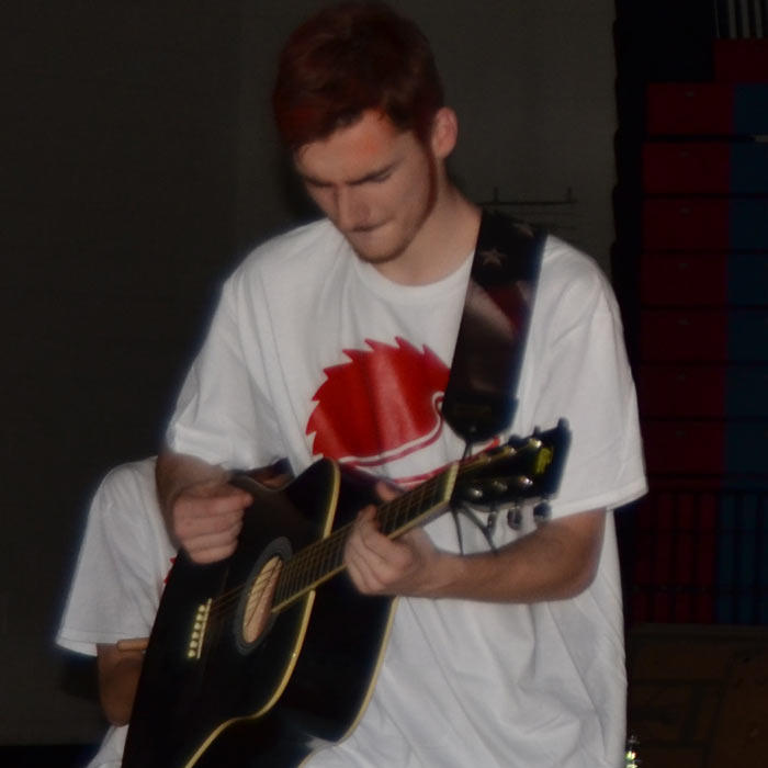 Jeffrey playing the lead guitar